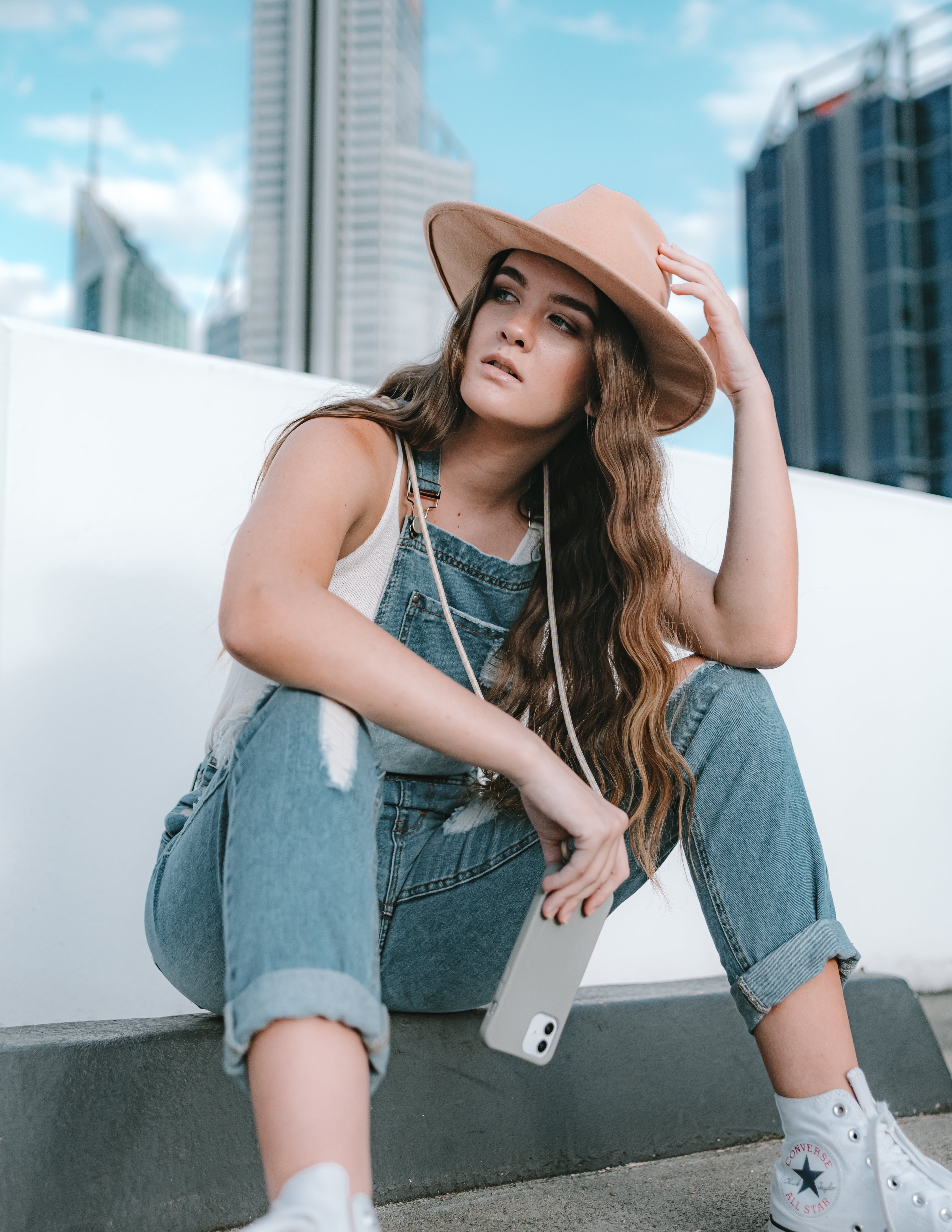 Universal phone patch designed to convert any iPhone, Samsung, or Huawei model into a crossbody phone case. This versatile accessory features a durable adhesive back that attaches securely to your smartphone, allowing you to add a crossbody strap for hands-free convenience.