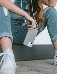 Universal phone patch designed to convert any iPhone, Samsung, or Huawei model into a crossbody phone case. This versatile accessory features a durable adhesive back that attaches securely to your smartphone, allowing you to add a crossbody strap for hands-free convenience.