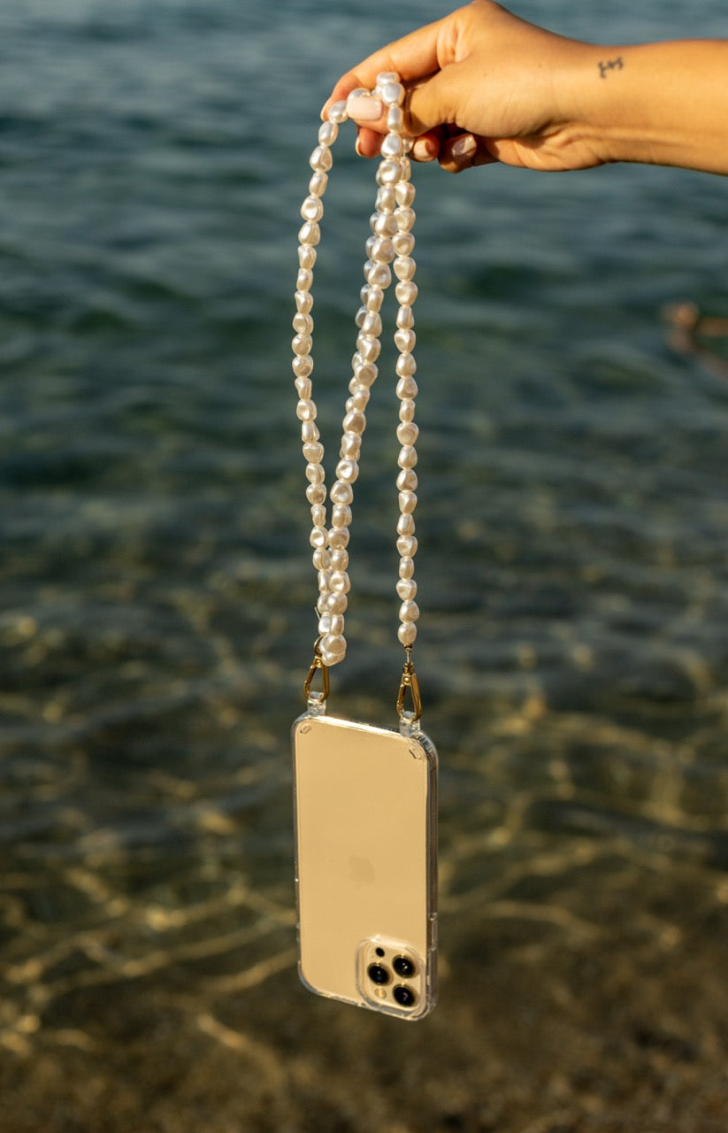 Netflix Emily in Paris Pearl Phone Case Emsy Australia crossbody phone cases are compatible with iPhone, Samsung models. The cases offer protection with durable cords, keeping phones secure with fashionable coloured ropes to elevate your style.