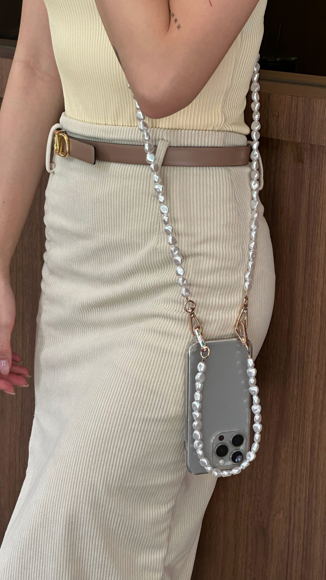 Netflix Emily in Paris Pearl Phone Case Emsy Australia crossbody phone cases are compatible with iPhone, Samsung models. The cases offer protection with durable cords, keeping phones secure with fashionable coloured ropes to elevate your style.