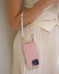 Close-up of a chic pearl phone wristlet, as seen on Netflix's Emily in Paris. This elegant accessory combines timeless style with modern functionality, perfect for adding a touch of Parisian flair to any outfit. Phone Accessory for any girl and any phone.