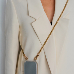 Close-up of the Casablanca adjustable crossbody strap in premium vegan leather, featuring a sleek, clear design with gold hardware. Perfect for hands-free phone cases and wristlets, adding style and functionality to any outfit.