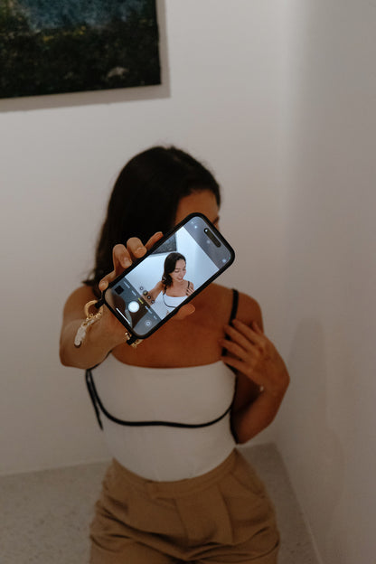 EMSY delivers stylish crossbody phone cases and wristlets made from premium vegan leather. Our versatile Golden Chain works for phones and cameras, offering hands-free convenience and interchangeable straps for fashion and functionality.