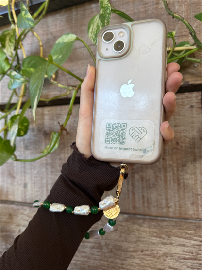 Meet the ultimate universal phone attachment from Perth! Designed to fit any phone and keep your device safe on the go, it’s the stylish, hands-free solution you’ve been looking for. But it’s more than just a smart accessory. We believe in giving back to our community—that’s why for every single purchase, we donate $5 AUD to support a great cause. Upgrade your everyday setup and join us in making a real difference with every order. Local roots, big heart. Pearl and green beaded wristlet. 