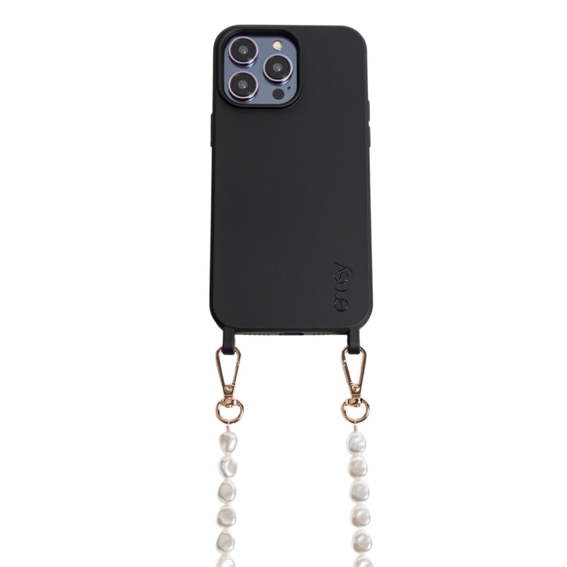 Close-up of a chic pearl phone wristlet, as seen on Netflix's Emily in Paris. This elegant accessory combines timeless style with modern functionality, perfect for adding a touch of Parisian flair to any outfit. Phone Accessory for any girl and any phone.