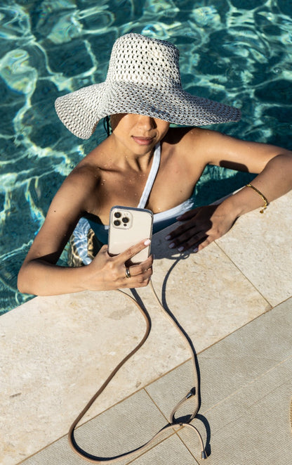 Universal phone patch designed to convert any iPhone, Samsung, or Huawei model into a crossbody phone case. This versatile accessory features a durable adhesive back that attaches securely to your smartphone, allowing you to add a crossbody strap for hands-free convenience. Ideal for on-the-go activities, it ensures your phone is always accessible while providing a modern, practical way to carry your device. Perfect for those who value functionality and style.