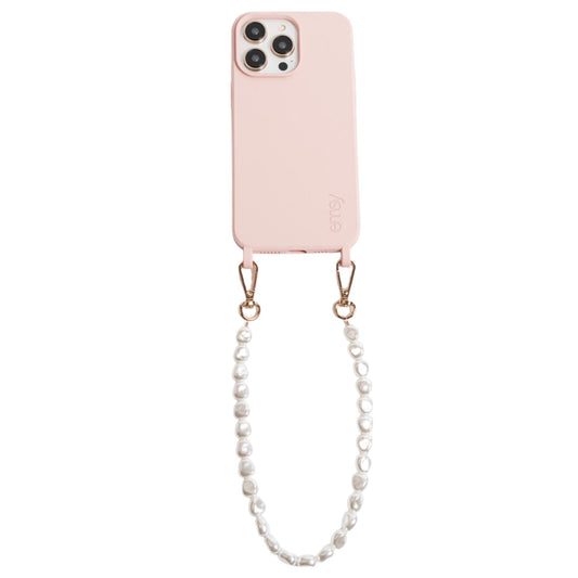 Close-up of a chic pearl phone wristlet, as seen on Netflix's Emily in Paris. This elegant accessory combines timeless style with modern functionality, perfect for adding a touch of Parisian flair to any outfit. Phone Accessory for any girl and any phone.