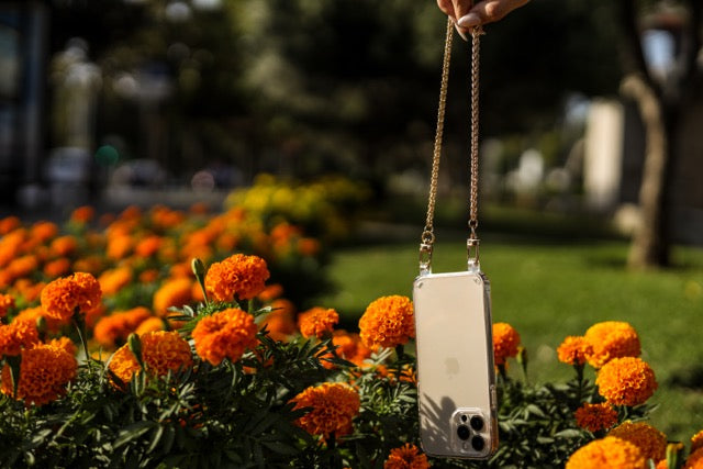 Close-up of the Casablanca adjustable crossbody strap in premium vegan leather, featuring a sleek, clear design with gold hardware. Perfect for hands-free phone cases and wristlets, adding style and functionality to any outfit.