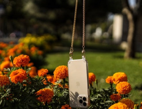 Close-up of the Casablanca adjustable crossbody strap in premium vegan leather, featuring a sleek, clear design with gold hardware. Perfect for hands-free phone cases and wristlets, adding style and functionality to any outfit.